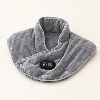 Coussin chauffant gris posé à plat, boîtier de commande au centre